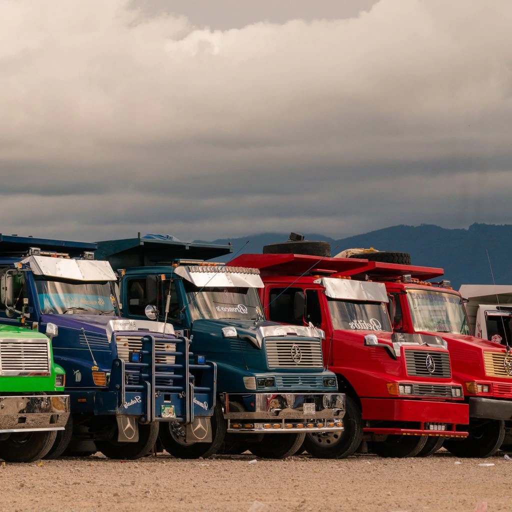 A line of 85-ton dump trucks waiting at a Hokkaido quarry